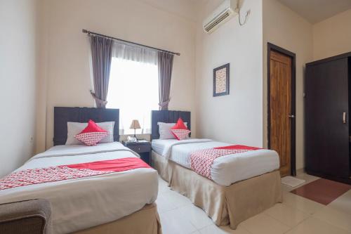 Imagen de la habitación del Hotel OYO 424 Asia Hotel. Foto 4