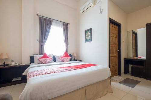 Imagen de la habitación del Hotel OYO 424 Asia Hotel. Foto 5