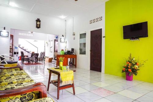 Imagen general del Hotel OYO 433 Nelvi Guest House Syariah. Foto 2