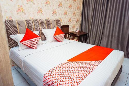 Imagen general del Hotel OYO 433 Nelvi Guest House Syariah. Foto 7
