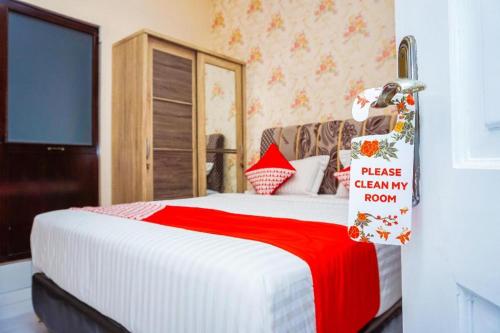 Imagen general del Hotel OYO 433 Nelvi Guest House Syariah. Foto 8