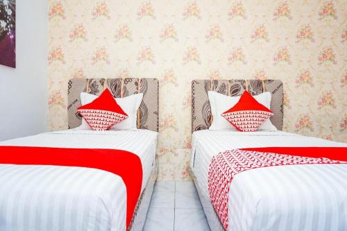 Imagen general del Hotel OYO 433 Nelvi Guest House Syariah. Foto 9