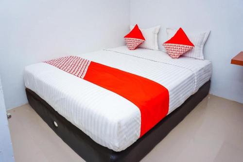 Imagen general del Hotel OYO 433 Nelvi Guest House Syariah. Foto 10