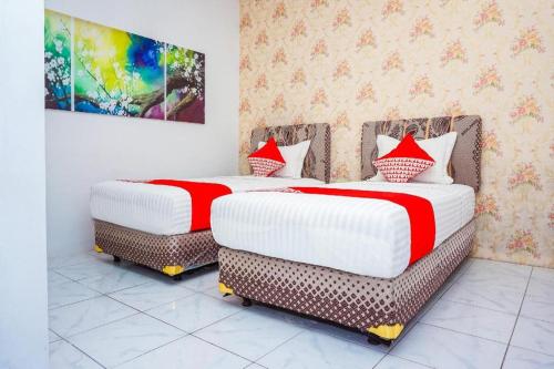 Imagen general del Hotel OYO 433 Nelvi Guest House Syariah. Foto 11