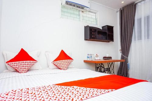 Imagen general del Hotel OYO 433 Nelvi Guest House Syariah. Foto 12