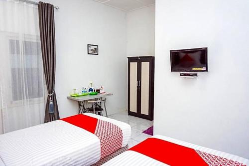 Imagen general del Hotel OYO 433 Nelvi Guest House Syariah. Foto 13