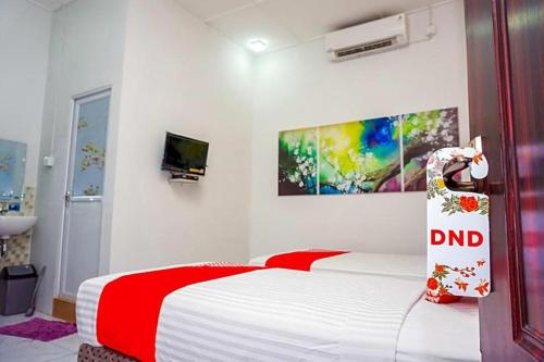Imagen general del Hotel OYO 433 Nelvi Guest House Syariah. Foto 15