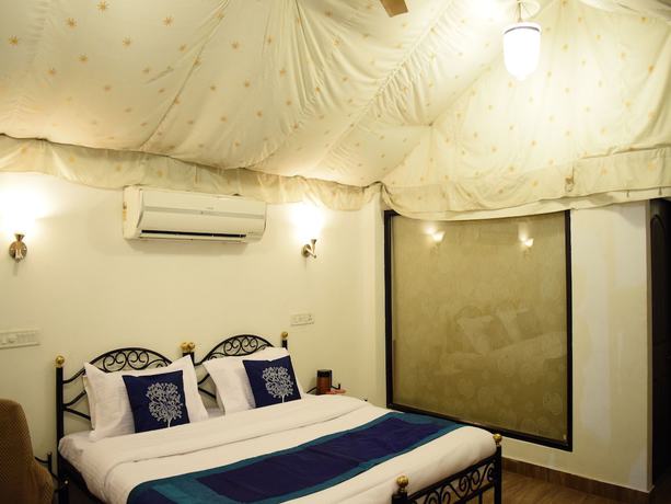 Imagen de la habitación del Hotel OYO 4353 Aravali Tent Resort. Foto 14