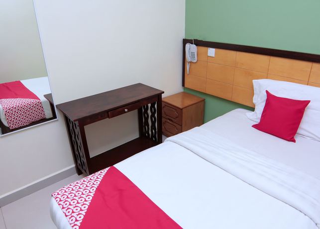 Imagen de la habitación del Hotel OYO 44054 Holiday Mansion Inn. Foto 2