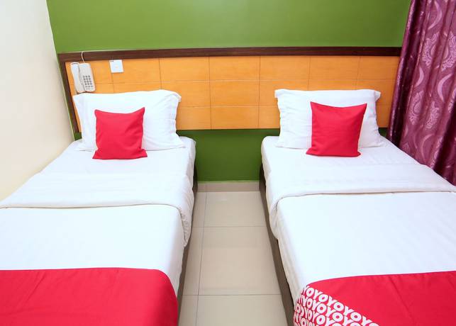 Imagen de la habitación del Hotel OYO 44054 Holiday Mansion Inn. Foto 4