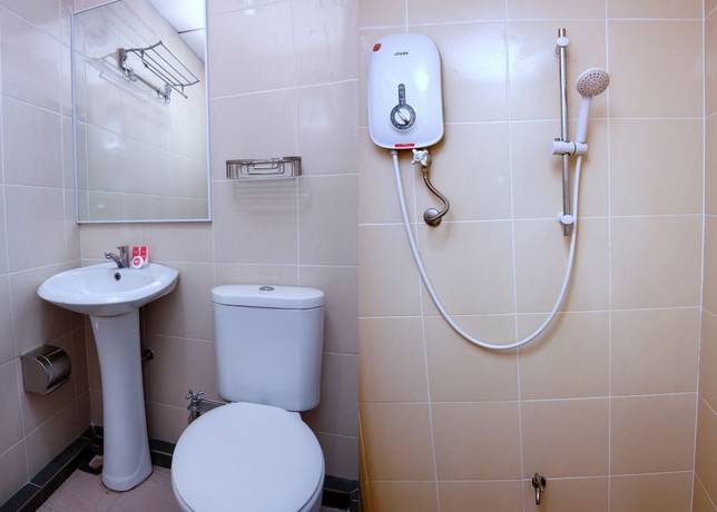 Imagen de la habitación del Hotel OYO 44054 Holiday Mansion Inn. Foto 5
