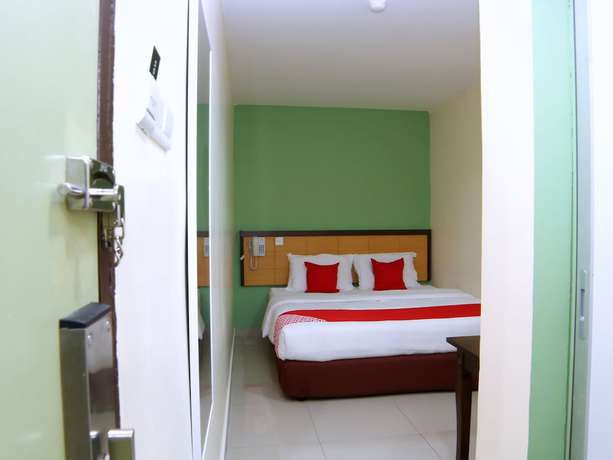 Imagen de la habitación del Hotel OYO 44054 Holiday Mansion Inn. Foto 6