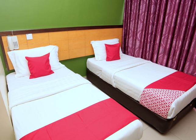 Imagen de la habitación del Hotel OYO 44054 Holiday Mansion Inn. Foto 9