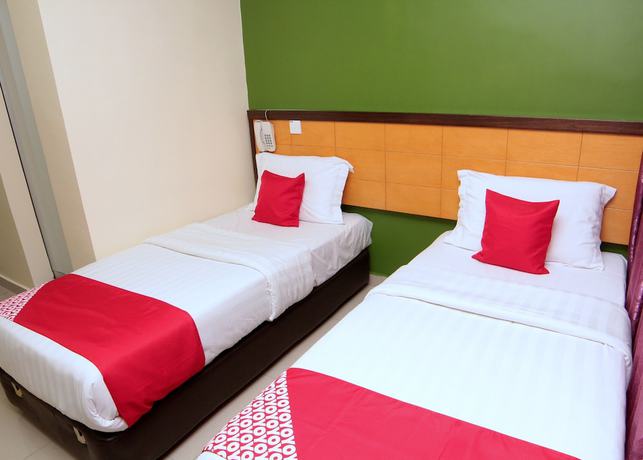 Imagen de la habitación del Hotel OYO 44054 Holiday Mansion Inn. Foto 10