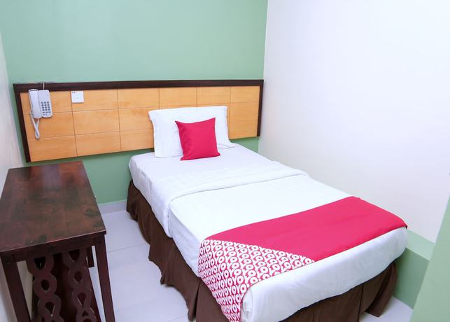 Imagen de la habitación del Hotel OYO 44054 Holiday Mansion Inn. Foto 11