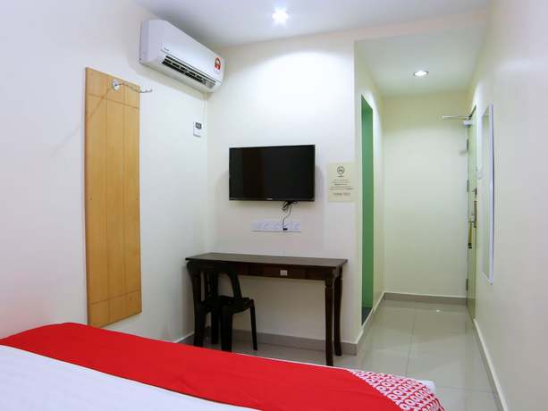 Imagen de la habitación del Hotel OYO 44054 Holiday Mansion Inn. Foto 13