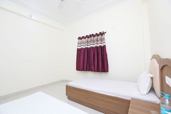 Imagen de la habitación del Hotel OYO 44618 Paradise Guest House. Foto 7
