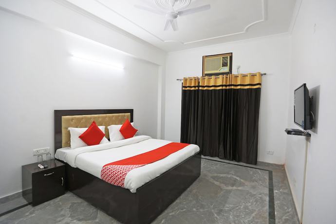 Imagen de la habitación del Hotel OYO 48900 Grand and Epic Inn. Foto 4
