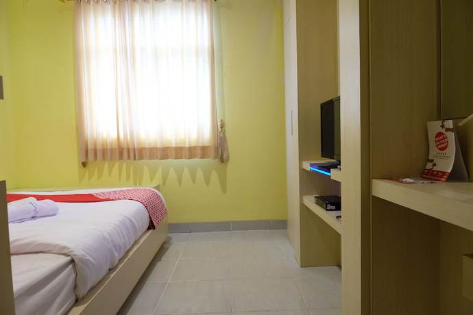 Imagen de la habitación del Hotel OYO 515 Oasis. Foto 16