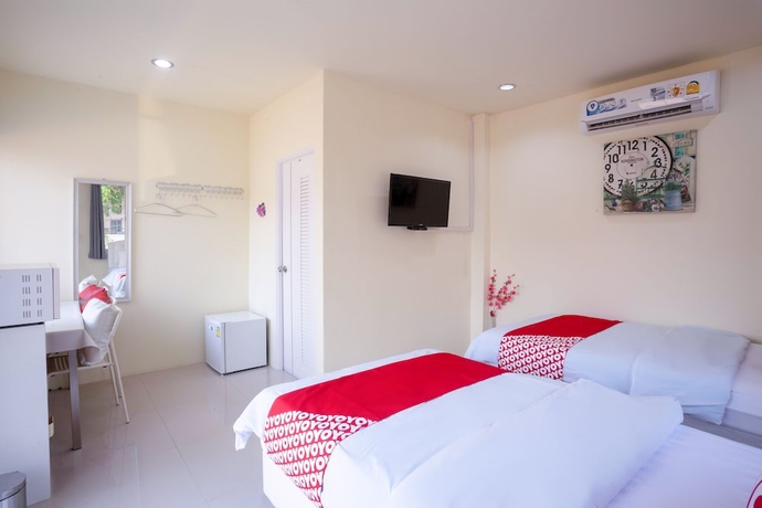 Imagen de la habitación del Hotel OYO 556 Chaisathan Cottage. Foto 9