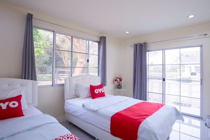 Imagen de la habitación del Hotel OYO 556 Chaisathan Cottage. Foto 11