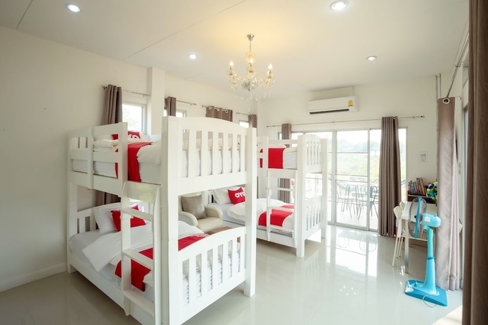 Imagen de la habitación del Hotel OYO 556 Chaisathan Cottage. Foto 15