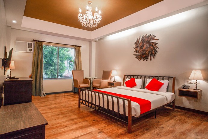 Imagen de la habitación del Hotel OYO 579 Anisabel Suites. Foto 13