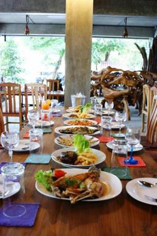 Imagen de la habitación del Hotel OYO 595 Mac Garden Resort. Foto 8