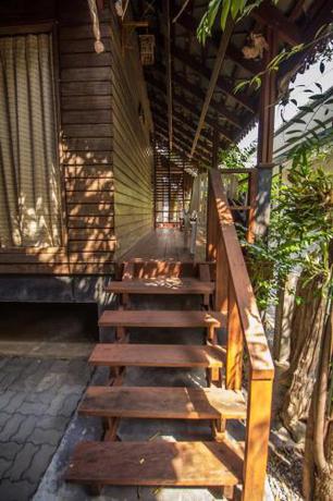 Imagen de la habitación del Hotel OYO 595 Mac Garden Resort. Foto 9