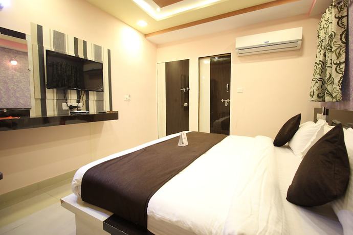 Imagen de la habitación del Hotel OYO 6478 Green Land. Foto 11