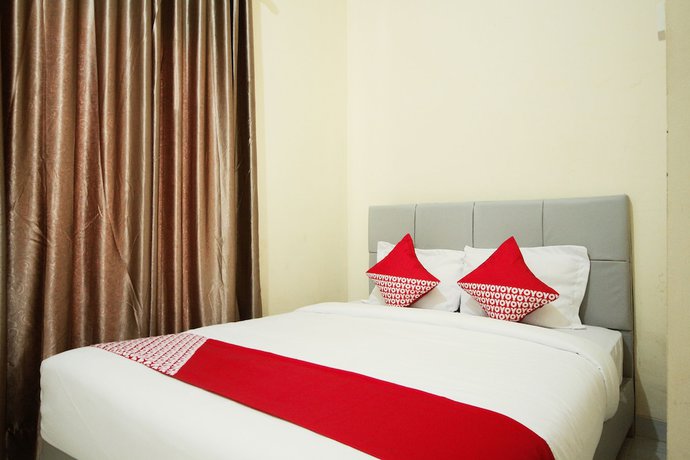 Imagen de la habitación del Hotel OYO 654 Fabio Guest House Syariah. Foto 11