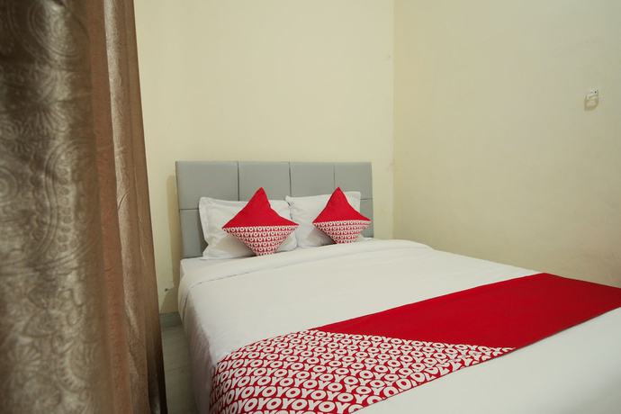 Imagen de la habitación del Hotel OYO 654 Fabio Guest House Syariah. Foto 15