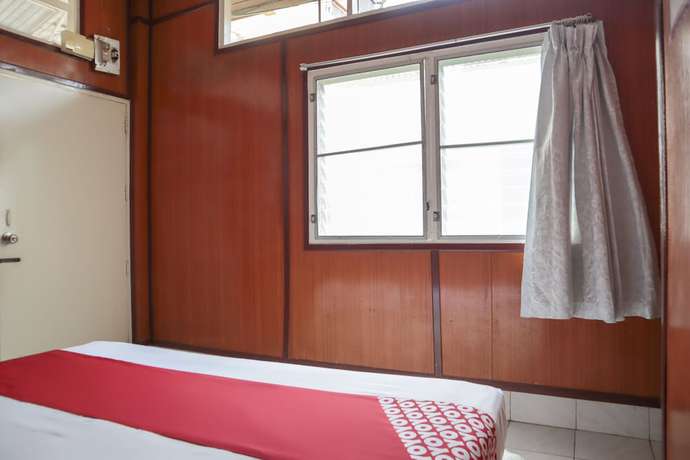 Imagen de la habitación del Hotel OYO 681 Paradise. Foto 10