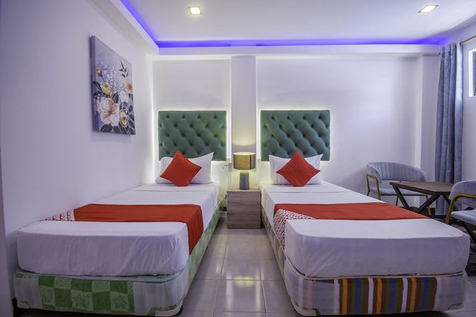 Imagen de la habitación del Hotel OYO 725 Richdel Resort. Foto 5