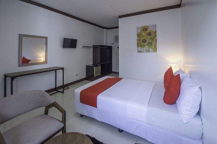 Imagen de la habitación del Hotel OYO 725 Richdel Resort. Foto 6