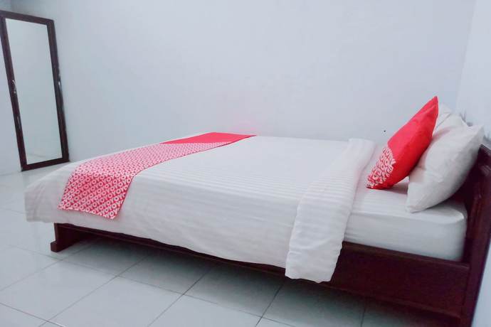 Imagen de la habitación del Hotel OYO 752 Abz Guest House Syariah. Foto 14