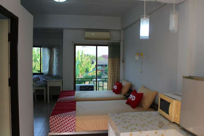 Imagen de la habitación del Hotel OYO 75420 Howto. Foto 10