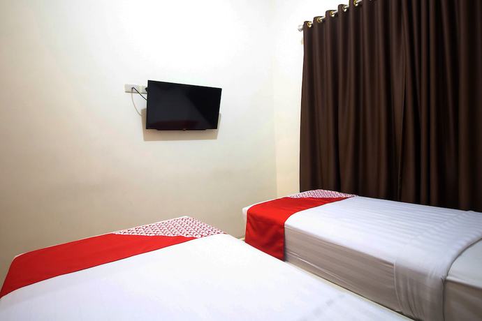 Imagen de la habitación del Hotel OYO 765 Wisma Andalas Asri Syariah. Foto 2