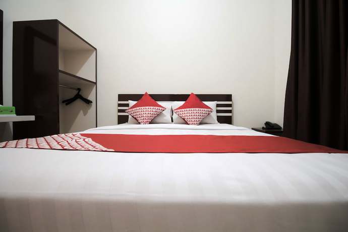 Imagen de la habitación del Hotel OYO 765 Wisma Andalas Asri Syariah. Foto 11