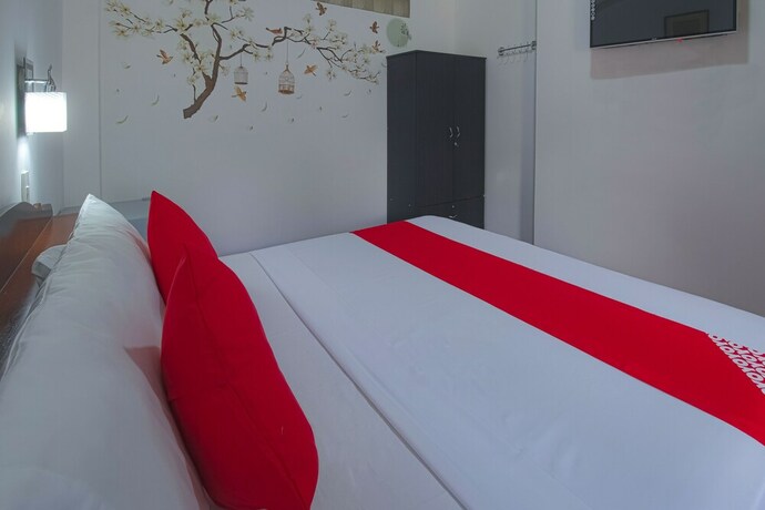 Imagen de la habitación del Hotel OYO 771 Darius' Residences. Foto 19
