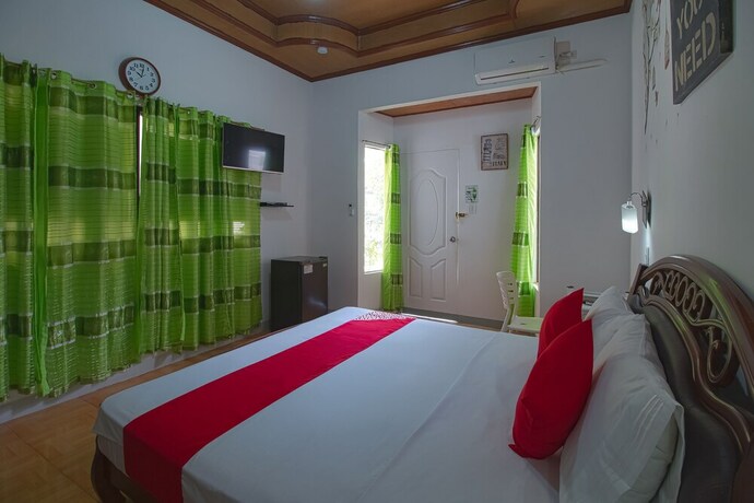 Imagen de la habitación del Hotel OYO 771 Darius' Residences. Foto 20