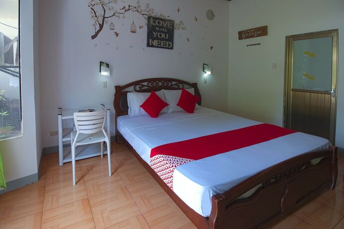 Imagen de la habitación del Hotel OYO 771 Darius' Residences. Foto 21
