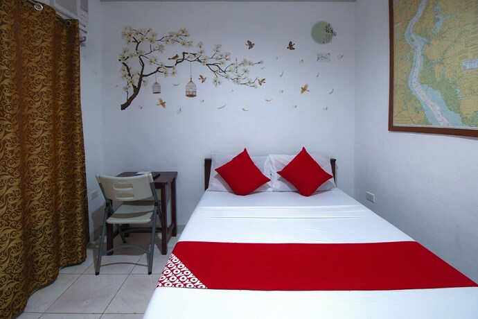 Imagen de la habitación del Hotel OYO 771 Darius' Residences. Foto 30