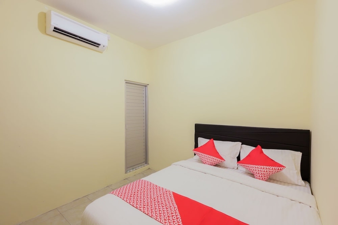 Imagen de la habitación del Hotel OYO 779 Mn One Residence Syariah Near ITC Cempaka Mas. Foto 4