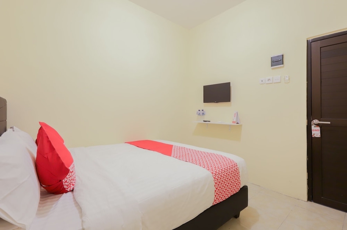 Imagen de la habitación del Hotel OYO 779 Mn One Residence Syariah Near ITC Cempaka Mas. Foto 5