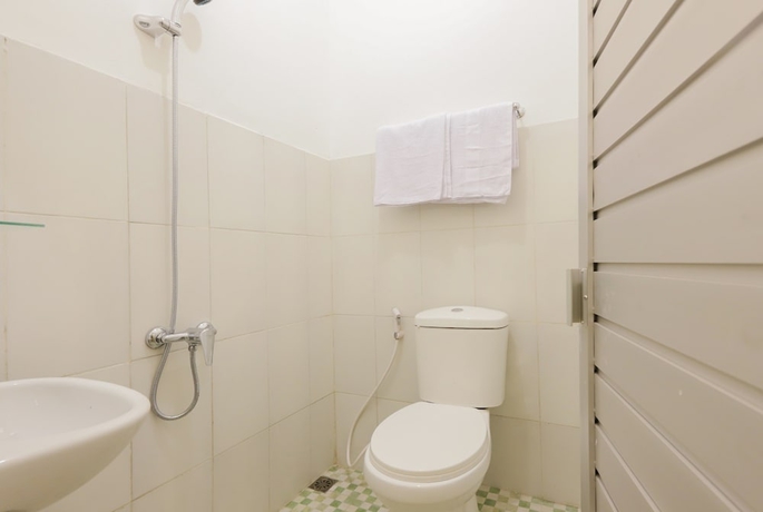 Imagen de la habitación del Hotel OYO 779 Mn One Residence Syariah Near ITC Cempaka Mas. Foto 12