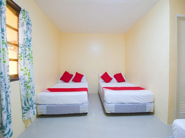 Imagen de la habitación del Hotel OYO 787 Indino Guest House 2and5. Foto 18