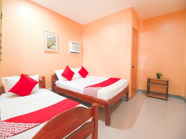 Imagen de la habitación del Hotel OYO 787 Indino Guest House 2and5. Foto 20