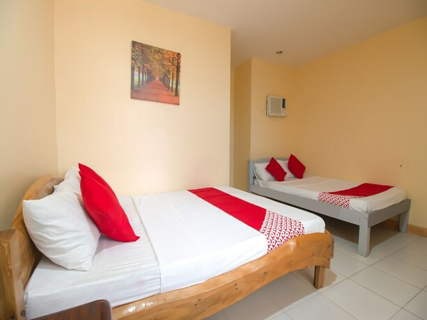Imagen de la habitación del Hotel OYO 787 Indino Guest House 2and5. Foto 23