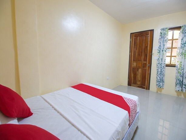 Imagen de la habitación del Hotel OYO 787 Indino Guest House 2and5. Foto 26